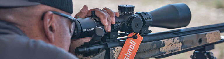 Man aiming with Bushnell scope Man aiming with Bushnell scope