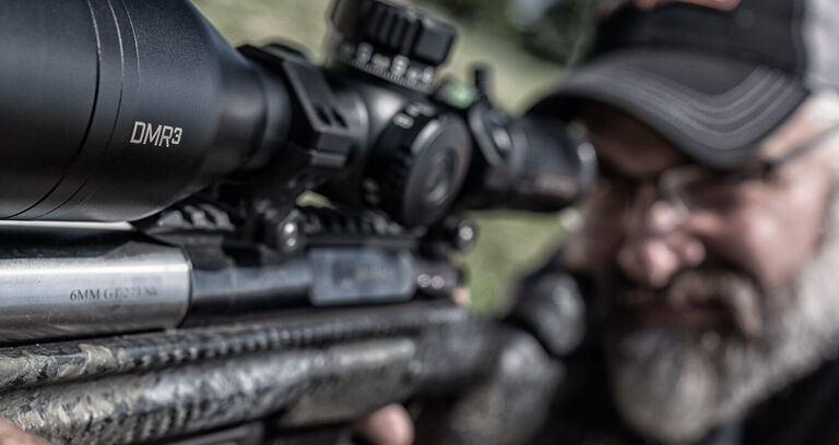 Shooter aiming through Elite Tactical DMR3 Riflescope Shooter aiming through Elite Tactical DMR3 Riflescope