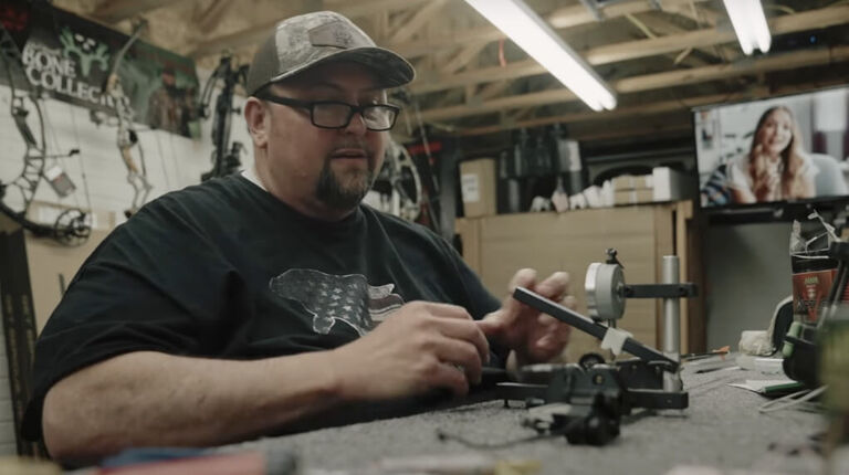 Is Your Bow Sighted In? Archer Hold Bow